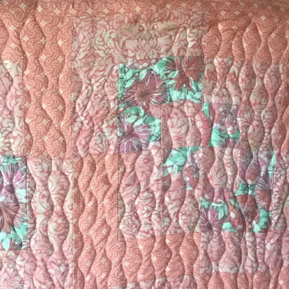 NWT. Hand Crafted Quilt in Corals